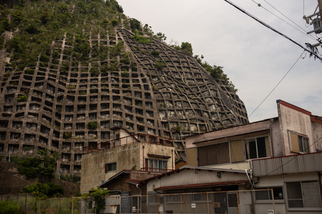 A mountain concreted over into a pleasing matrix of manmade ripples.